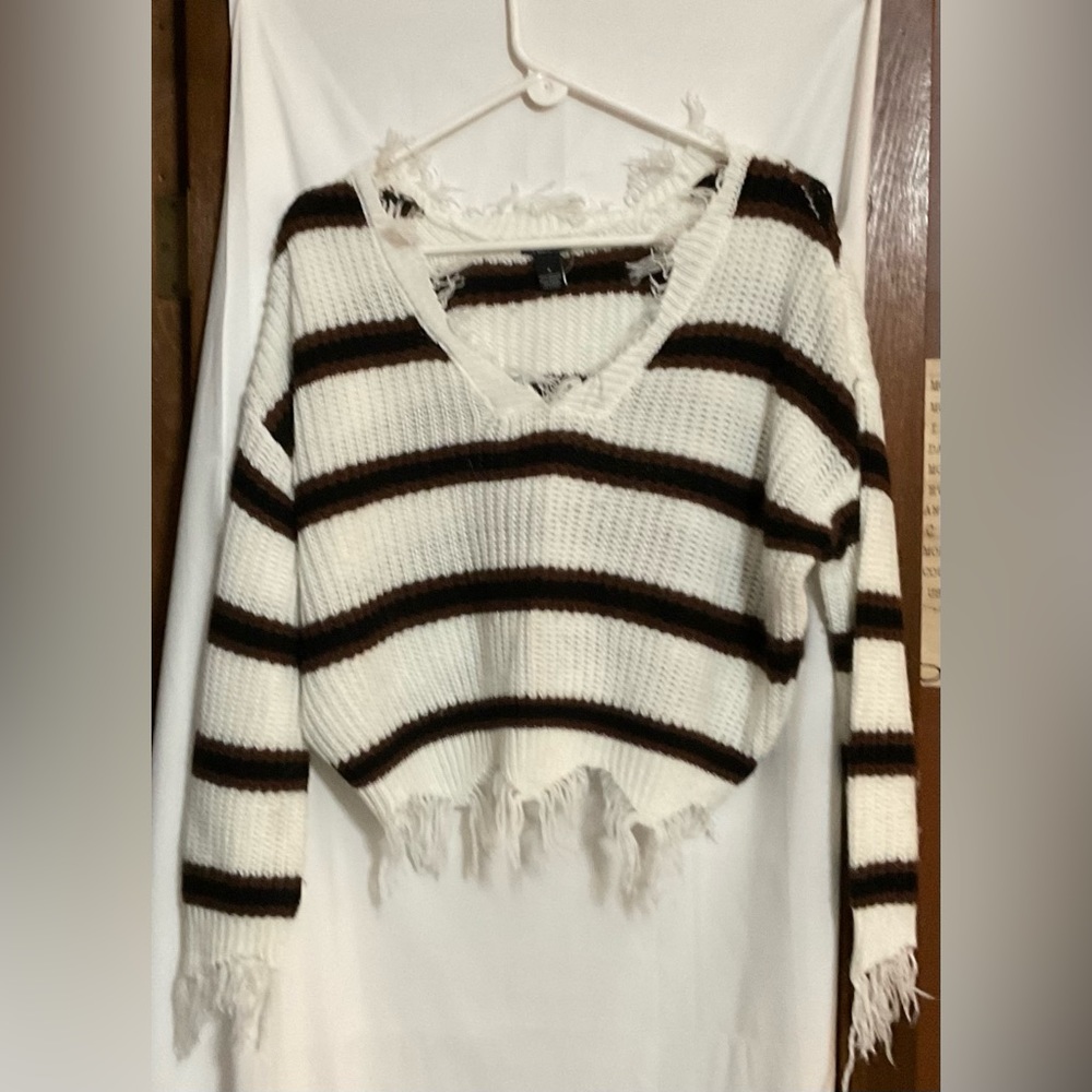 Rue 21: Small white and garnet strips sweater, with string fringe all around.